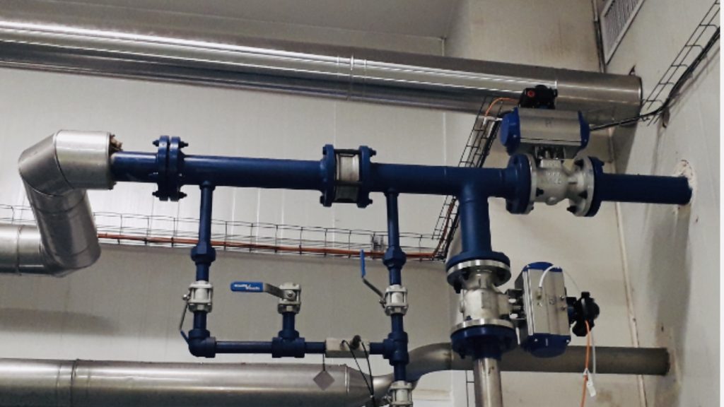 A blue pipe system with valves and pipes.