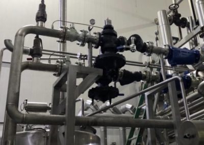 A large metal pipe system with many pipes.