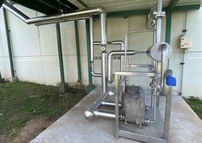Industrial stainless steel pipes and machinery setup.