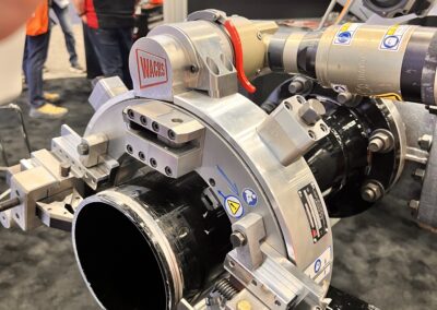 Pipe cutting machine at industrial exhibition.