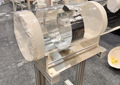Transparent cylindrical display on a metal stand.